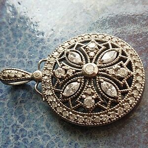 Sterling Silver and Cubic Zirconia Round Pendant with Intricate Design